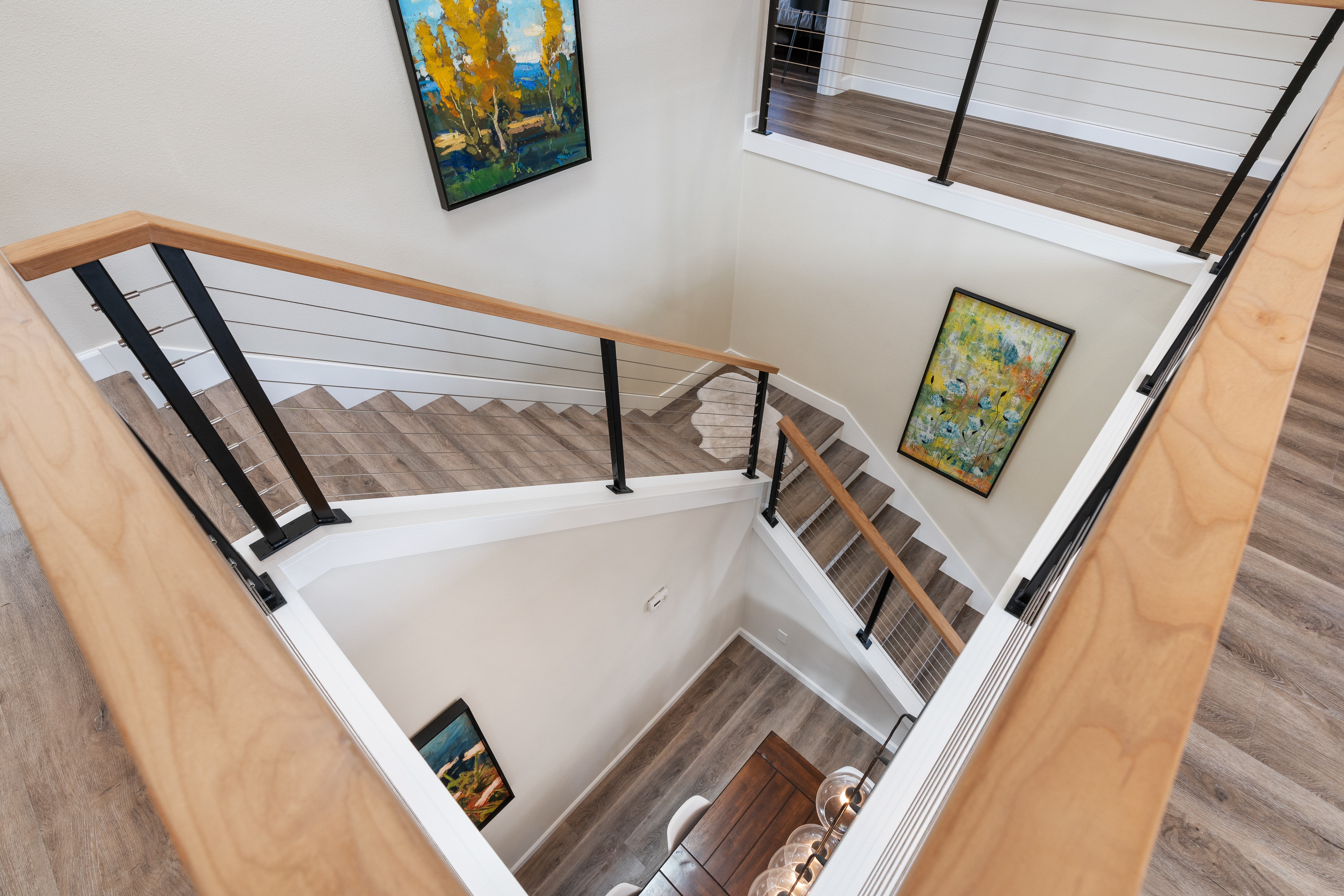 A finished photo of Remodeled Stairs with wire railing