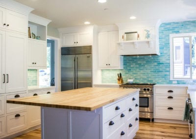 White Kitchen with Bold Blue Backsplash