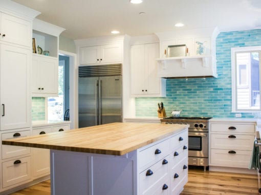 White Kitchen with Bold Blue Backsplash